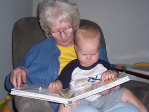 My mom reads to my grandson, Capt. Adorable. I love that they both are holding their mouths the exact same way.